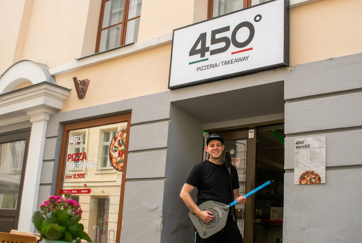 Owner standing in front of 450° Gradi in Tartu Old Town